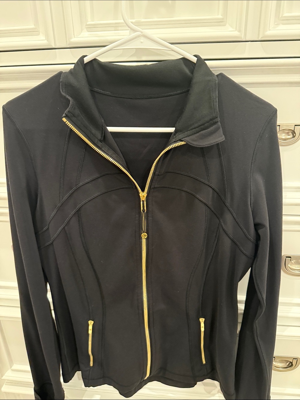 Black Lululemon define jacket with gold zipper and details